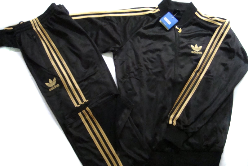 black adidas tracksuit with gold stripes